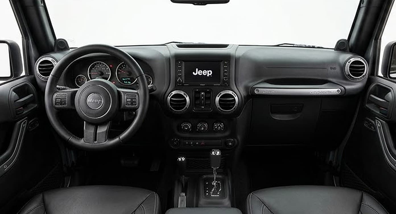 2016 Jeep Wrangler Unlimited Sahara — interior and dashboard